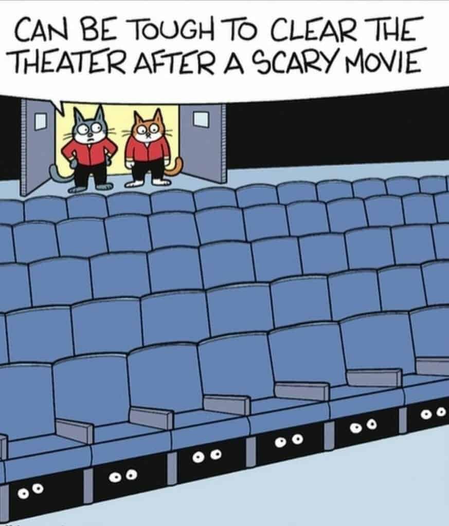 Cartoon of two cats looking at theater seats with pairs of eyes peering out from under the seats in the dark.