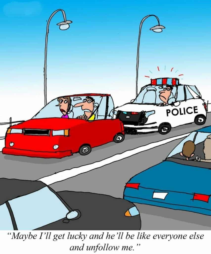 Cartoon showing a red car with a worried driver followed closely by a damaged police car; driver wonders if the cop will unfollow him like everyone else.