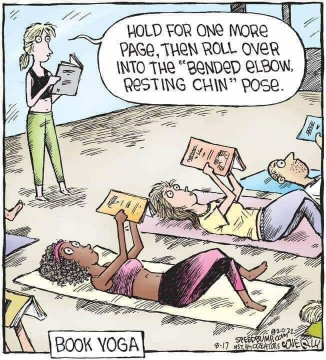 People lying on yoga mats holding books above them, practicing 'book yoga' positions guided by an instructor.