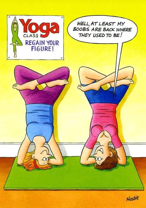 Two women doing headstand yoga poses in colorful clothes, one humorously notes her breasts have returned to their original position.