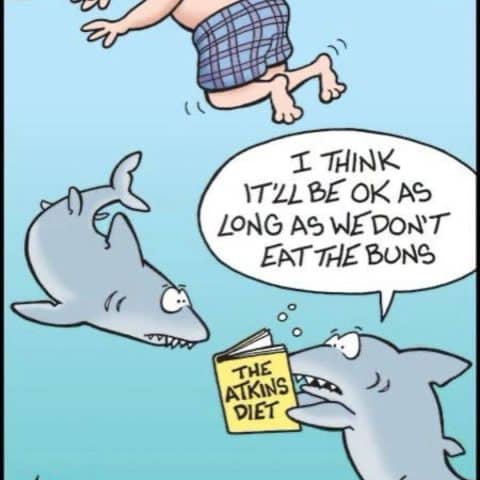 Cartoon of two sharks underwater looking worried as one reads a book titled 'The Atkins Diet' while a swimmer floats nearby.