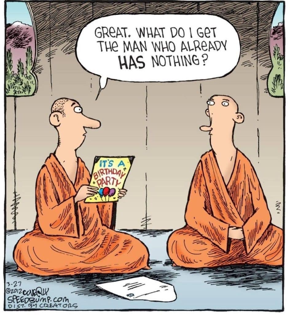 Two bald men in orange robes sitting cross-legged indoors. One holds a colorful birthday party invitation and asks, "Great. What do I get the man who already has nothing?"