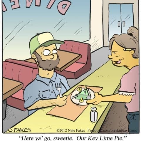 A man with a beard and cap sits at a diner table holding a fork. A waitress hands him a plate with a slice of pie made out of metal keys and lime wedges.