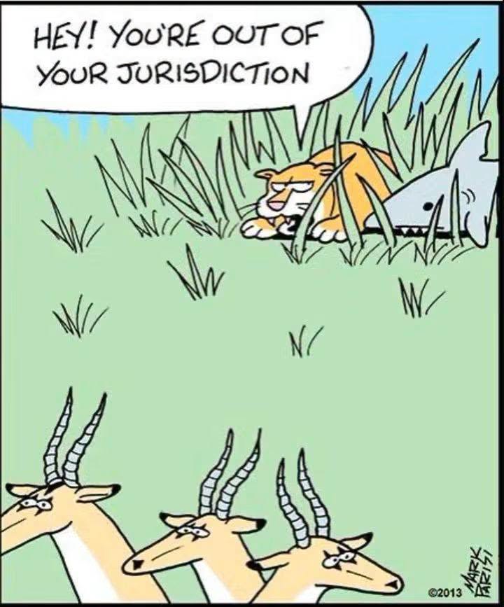 A lion crouches in grass stalking some antelopes while a shark emerges from the grass behind the lion, saying 'Hey! You're out of your jurisdiction'