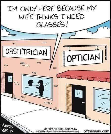 Two storefronts side by side labeled Obstetrician and Optician. A man inside says to a woman through a window, 'I'M ONLY HERE BECAUSE MY WIFE THINKS I NEED GLASSES!'.