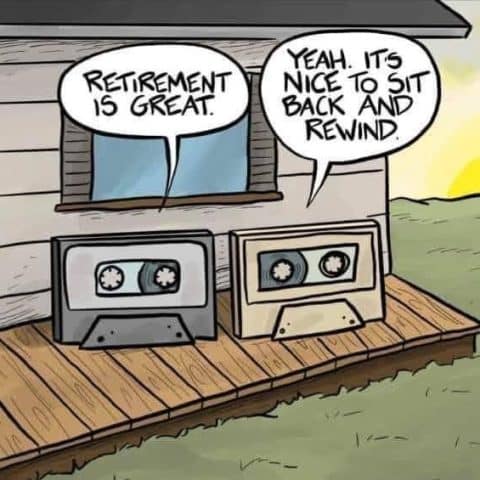 Two old cassette tapes sitting on a wooden porch, talking about retirement and rewinding during sunset.