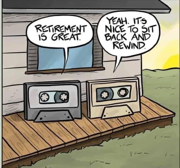 Two old cassette tapes sitting on a wooden porch, talking about retirement and rewinding during sunset.