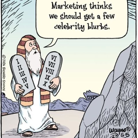 Moses holding two stone tablets with Roman numerals, saying marketing wants celebrity blurbs.