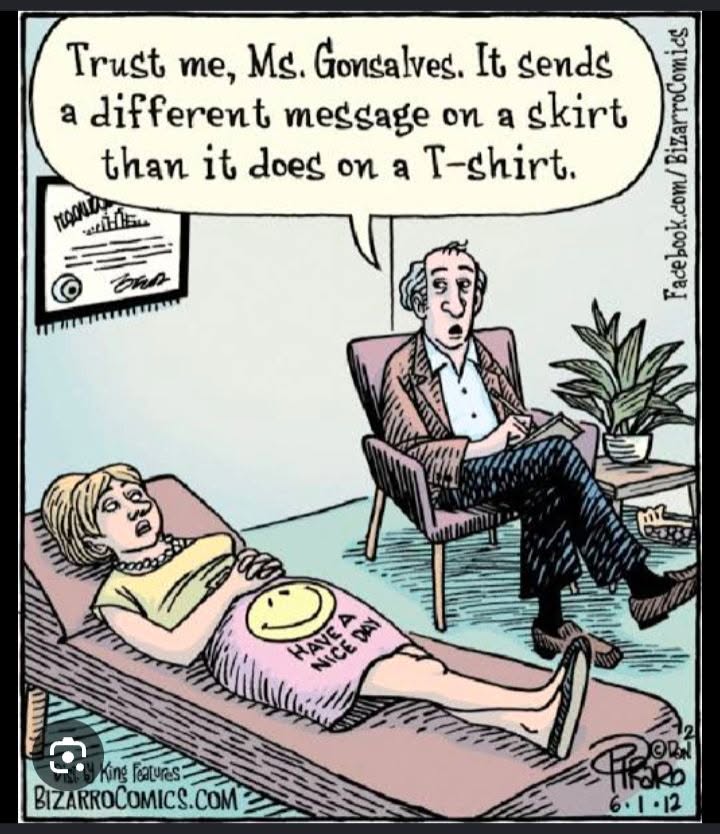 A woman lies on a therapy couch wearing a skirt with a smiley face and the words 'Have a nice day'. A male therapist in a chair talks to her.