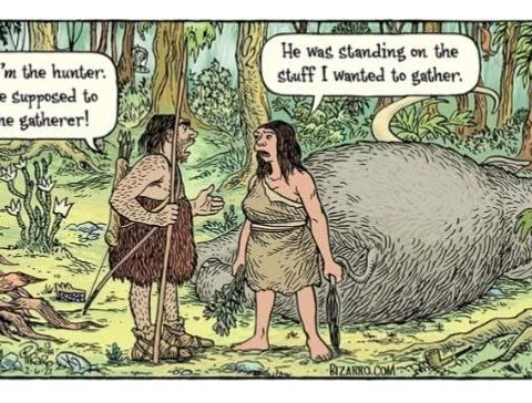 A prehistoric man holding a spear and a prehistoric woman holding a fish, arguing beside a large hunted animal lying on the ground in a forest setting. Speech bubbles show their dialogue about roles as hunter and gatherer.