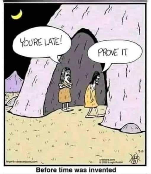 Two cave people standing outside a cave at night, one accusing the other of being late and the other replying 'Prove it'.