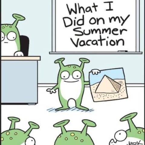 Cartoon of an alien standing in front of a classroom holding a photo of a pyramid, with a board behind reading 'What I Did on my Summer Vacation' and other aliens watching.