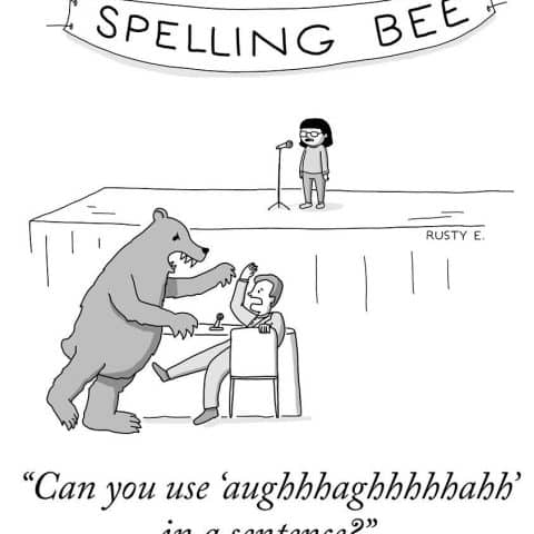 A person nervously sitting at a table with a bear raising its paws near him, below a stage with a child and a banner saying 'SPELLING BEE'.