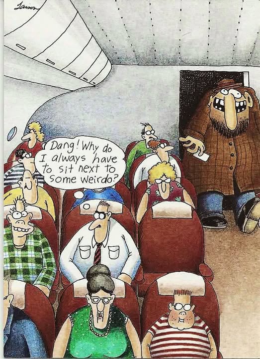 Inside an airplane cabin, a man in a suit seated among other passengers thinks: 'Dang! Why do I always have to sit next to some weirdo?' A large, oddly dressed passenger with a big nose stands near the entrance to the cabin.