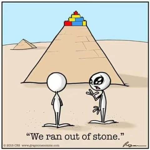 Two aliens in front of a pyramid made from LEGO blocks on top, one alien gesturing as if explaining, with text saying 'We ran out of stone.'