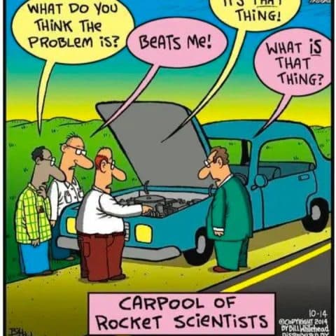 Four men stand around a broken-down car on the road, looking confused under the hood while discussing the problem.