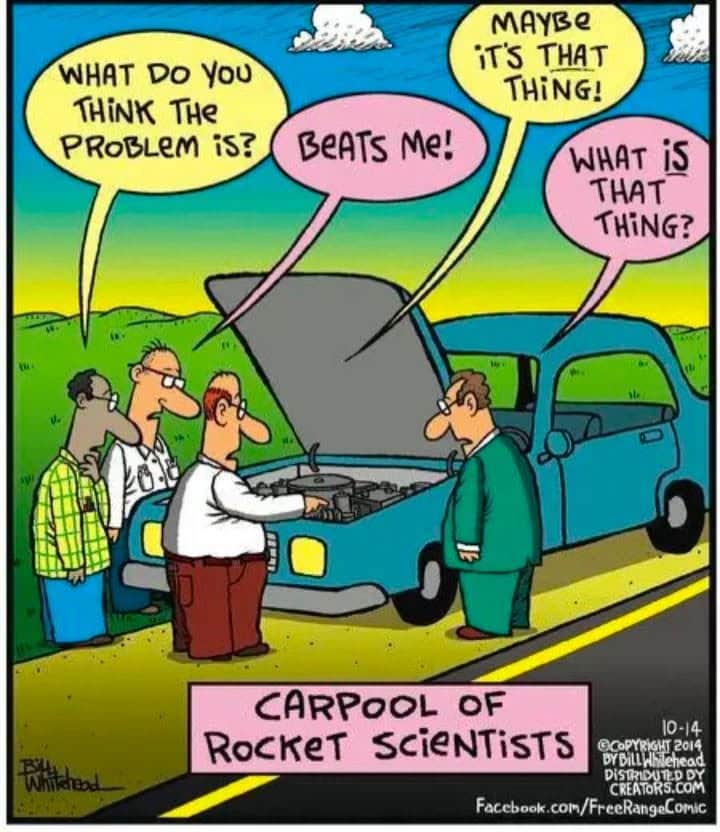 Four men stand around a broken-down car on the road, looking confused under the hood while discussing the problem.