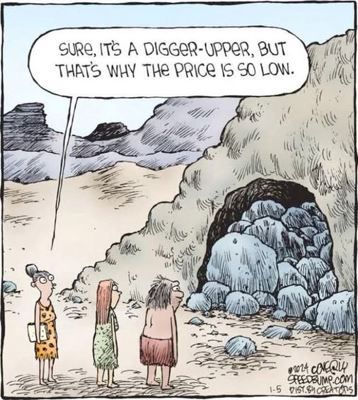 Three cavepeople standing outside a rocky cave entrance in a barren, mountainous area. One says the cave is a 'digger-upper' which is why the price is low.