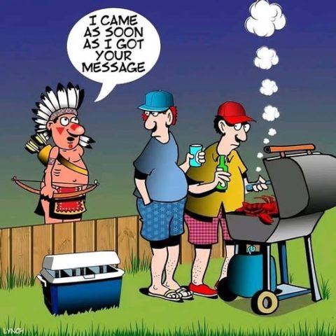 Cartoon featuring a Native American man in traditional attire talking to two men grilling food in a backyard, with one man holding a bottle and the other holding a drink can.